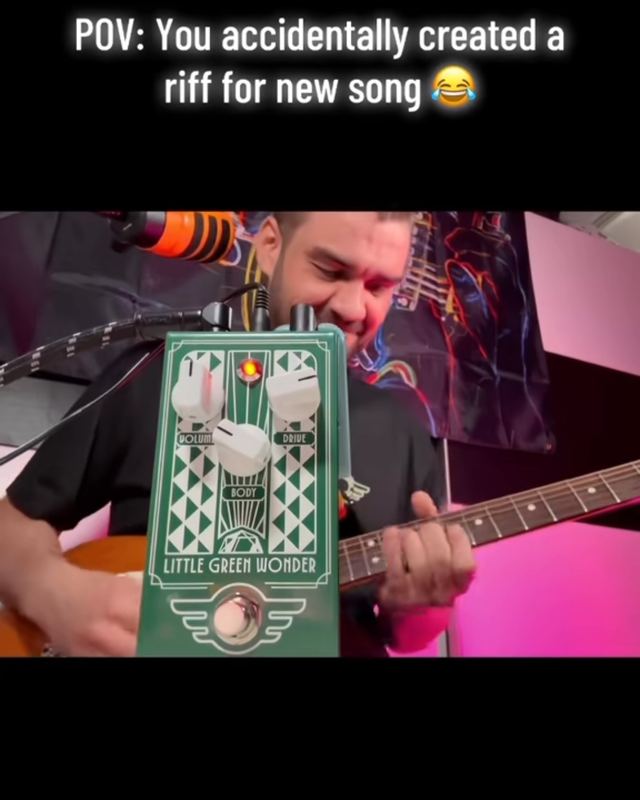 Dusan playing guitar in a studio next to a green overdrive pedal