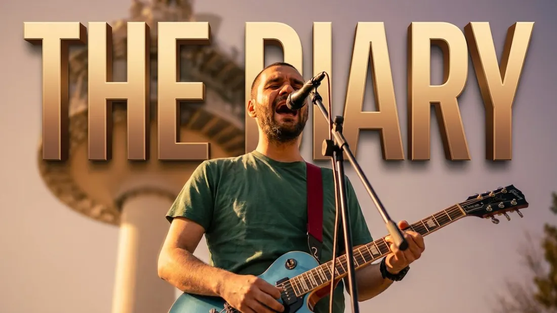 Dusan performing Like It's a Law (The Diary) with an electric guitar and microphone at sunset
